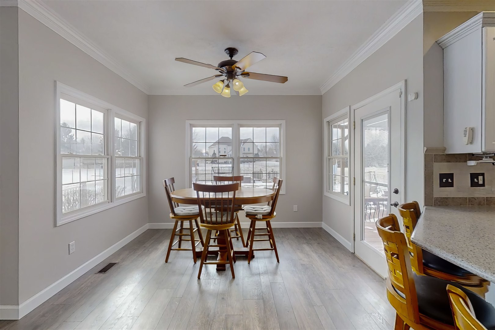 4 Cloverhill Circle Bloomington, IL 61705 - Photo 32 of 63 a dining room with furniture a chandelier and wooden floor