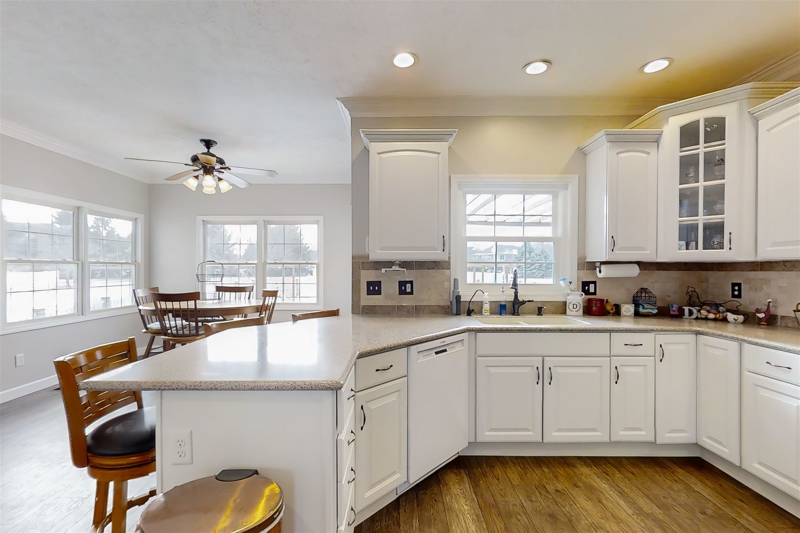 4 Cloverhill Circle Bloomington, IL 61705 - Photo 33 of 63 a large kitchen with cabinets chairs and chandelier