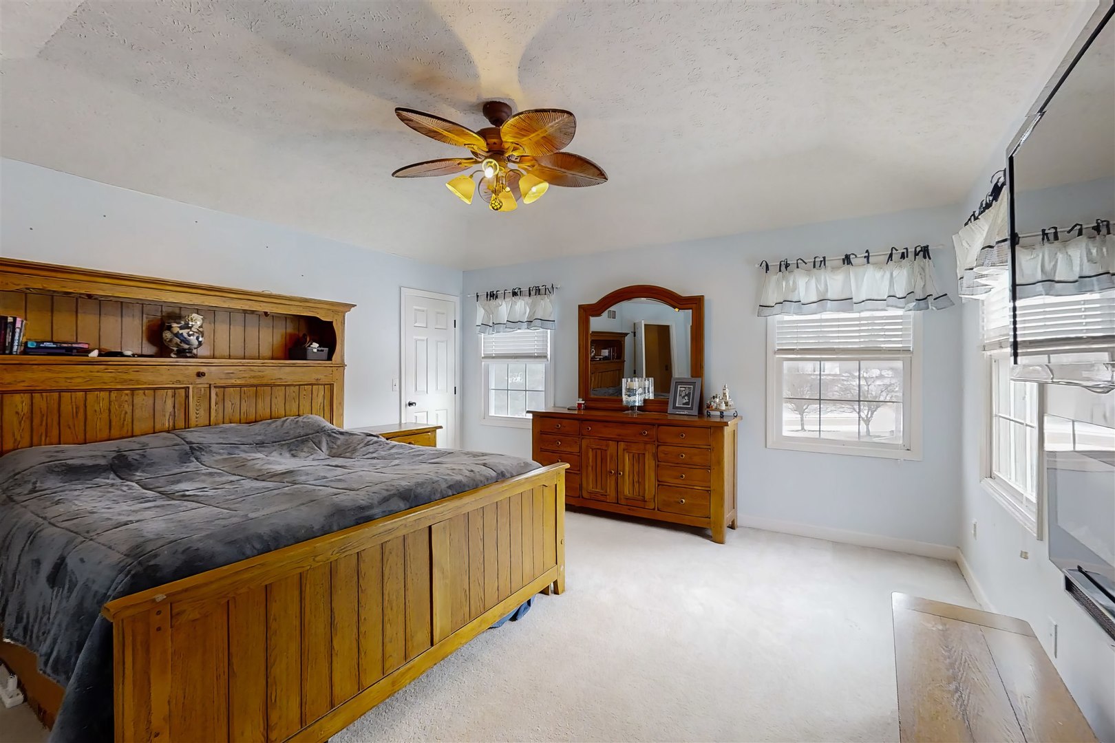 4 Cloverhill Circle Bloomington, IL 61705 - Photo 38 of 63 a bedroom with a bed and a chandelier
