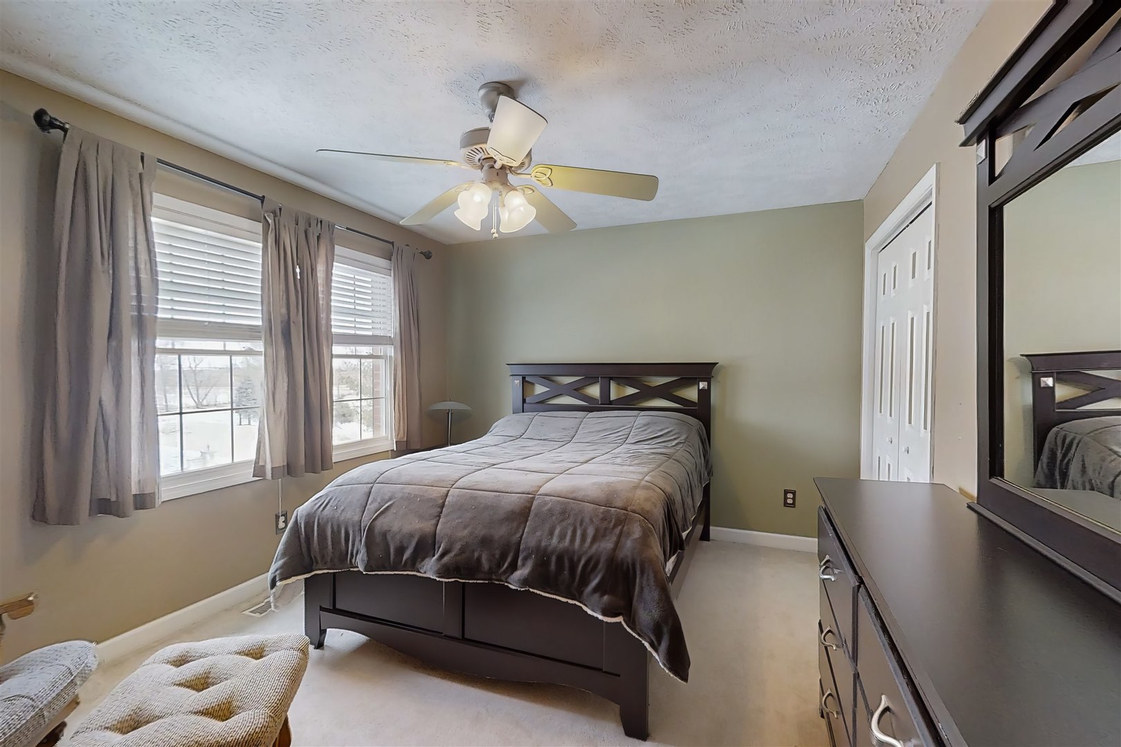 4 Cloverhill Circle Bloomington, IL 61705 - Photo 43 of 63 a bedroom with a bed chandelier and a window