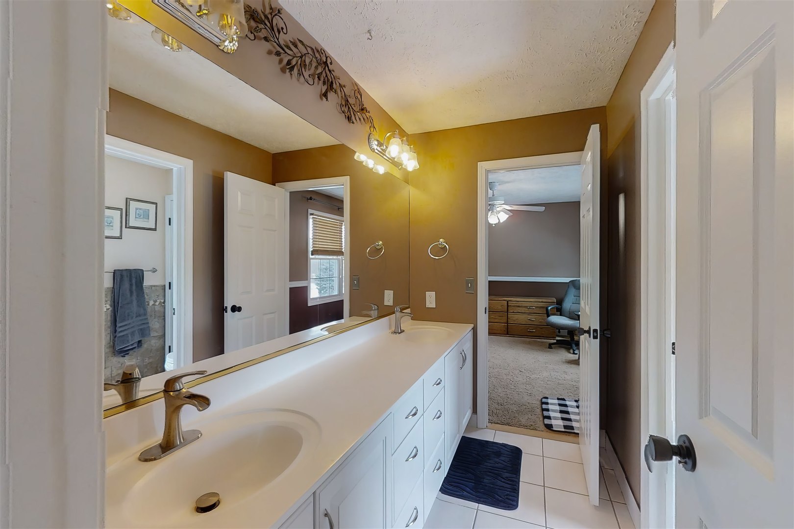 4 Cloverhill Circle Bloomington, IL 61705 - Photo 45 of 63 a spacious bathroom with a double vanity sink and a mirror
