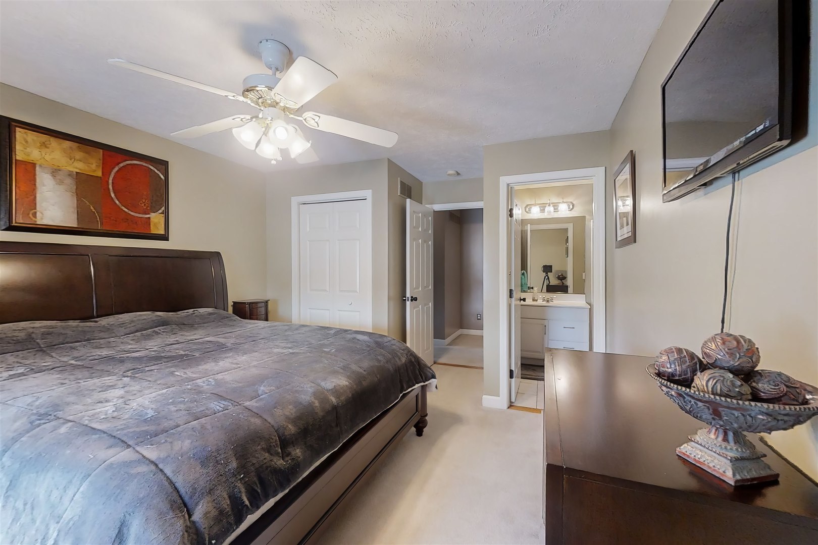 4 Cloverhill Circle Bloomington, IL 61705 - Photo 49 of 63 a bedroom with a bed and a chandelier