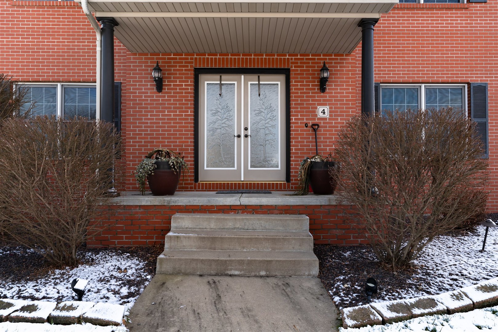 4 Cloverhill Circle Bloomington, IL 61705 - Photo 5 of 63 a front view of a house with garden