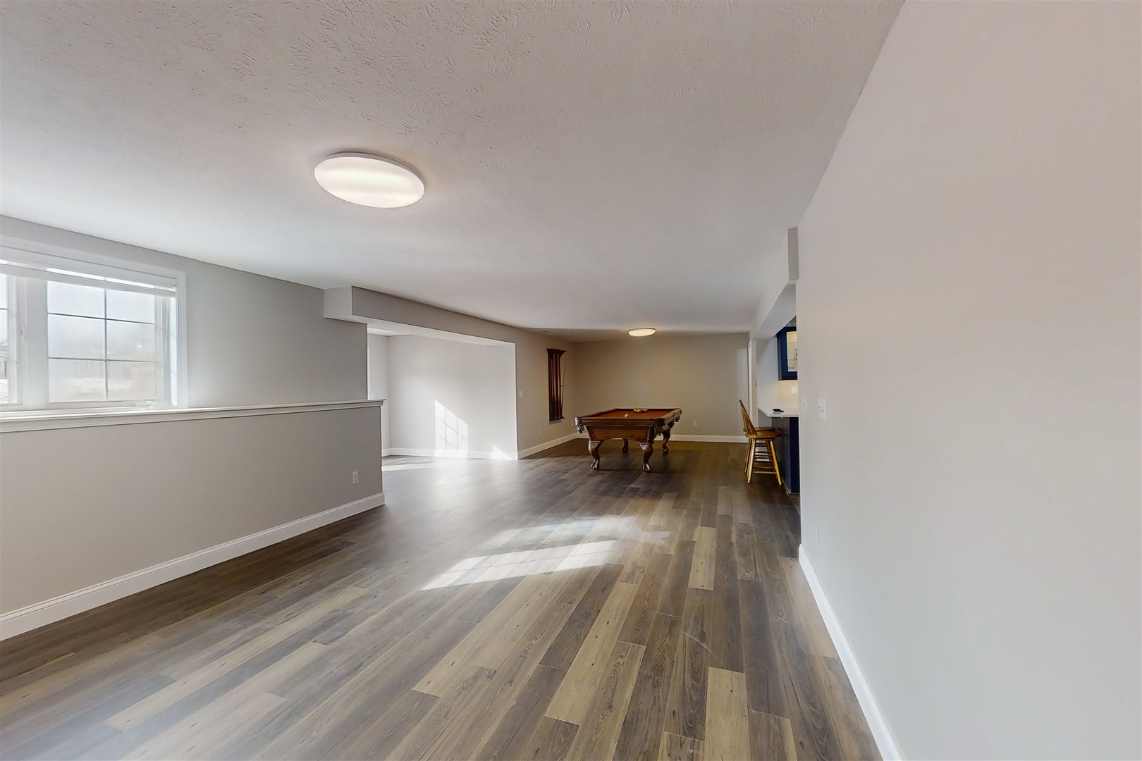 4 Cloverhill Circle Bloomington, IL 61705 - Photo 61 of 63 a view of a livingroom with wooden floor and staircase