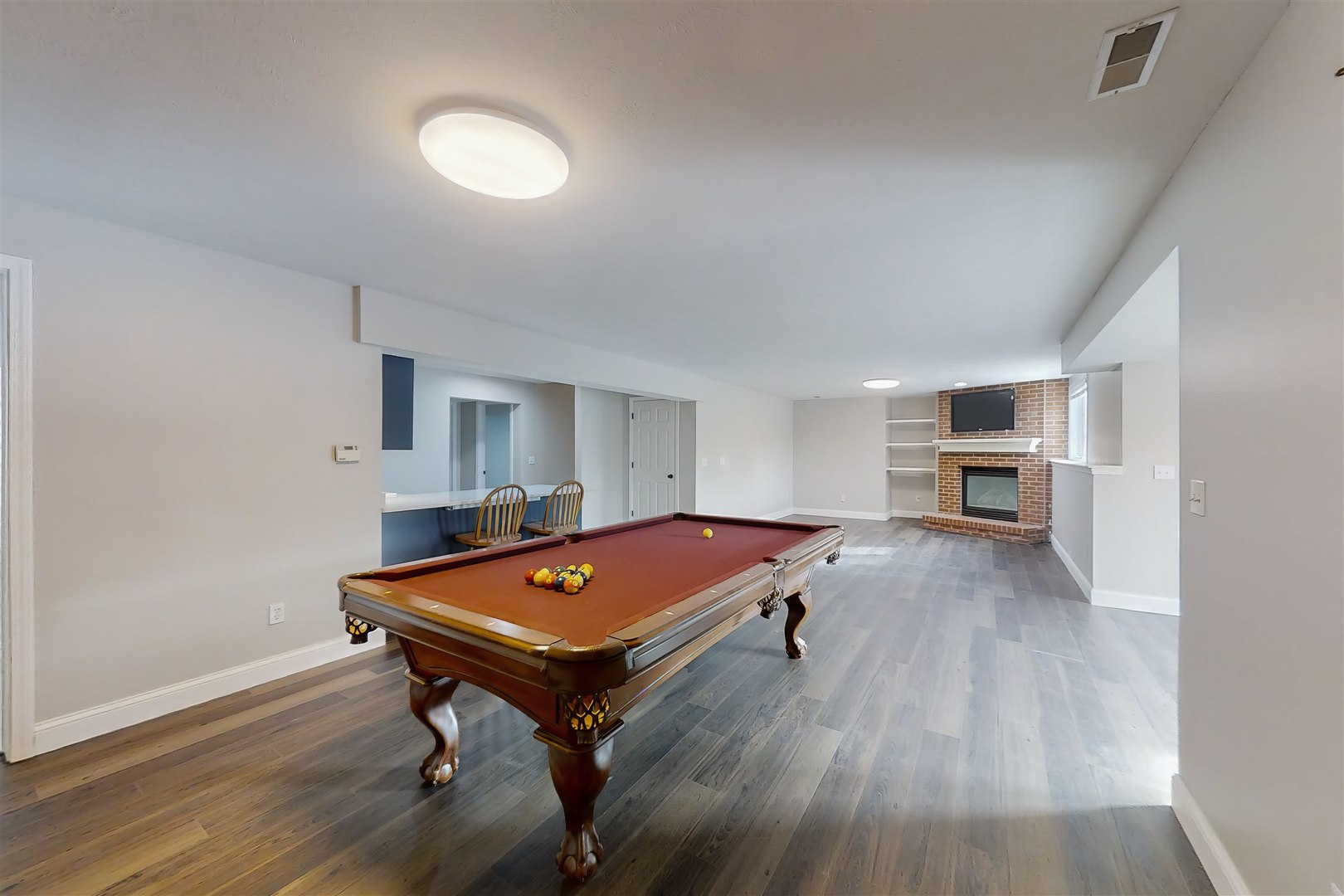 4 Cloverhill Circle Bloomington, IL 61705 - Photo 62 of 63 a living room with furniture pool table and flat screen