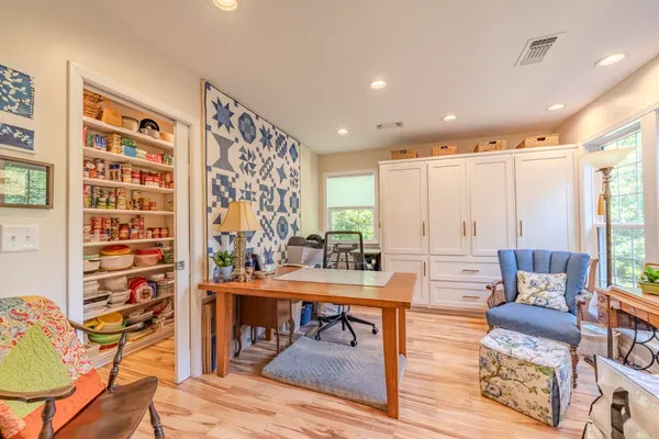 a living room with furniture and a rug