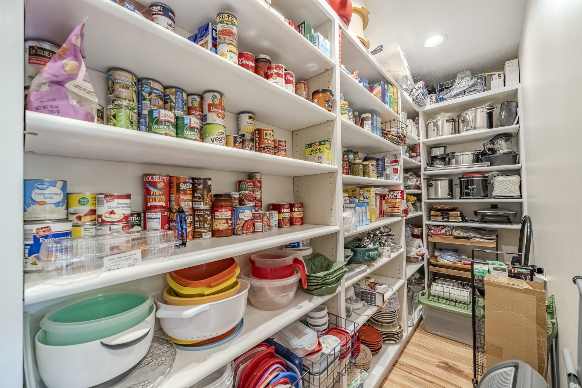 85 Cr 256 Road Iuka, MS 38852 - Photo 14 of 38 Spacious pantry featuring extensive built-in shelving, recessed lighting, and wood-finish flooring
