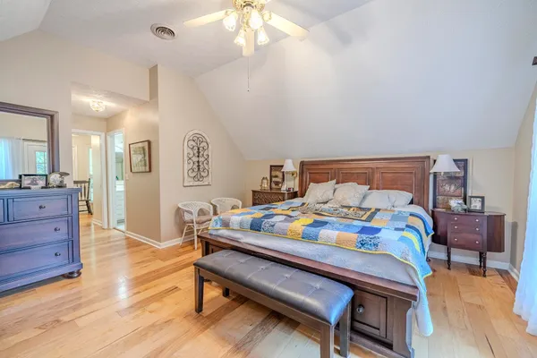a bedroom with a bed and a table in it