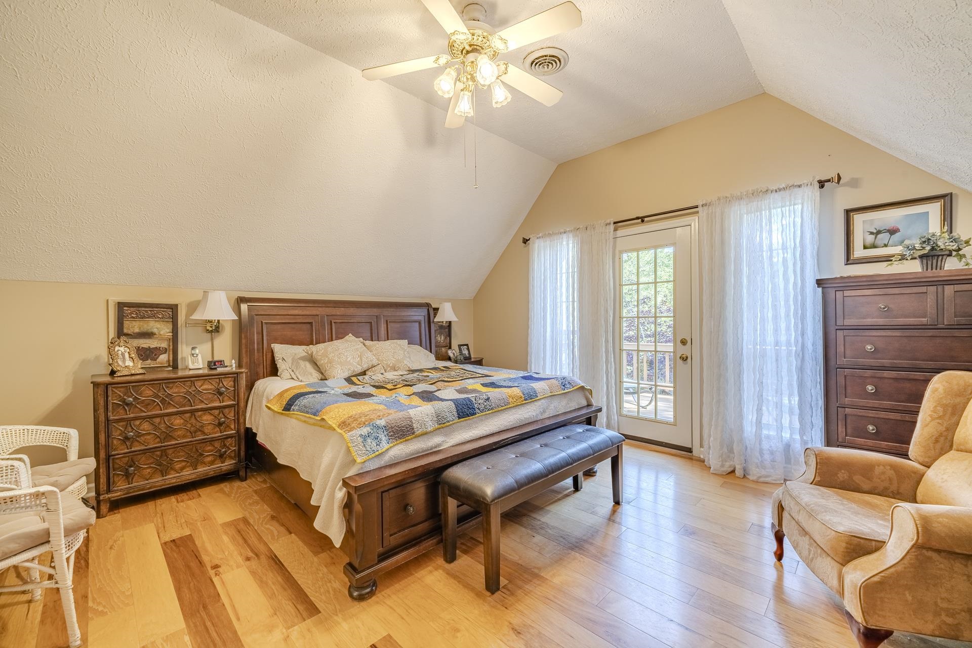 85 Cr 256 Road Iuka, MS 38852 - Photo 18 of 38 Bedroom featuring wood-finish flooring, a ceiling fan with integrated lighting, and a French door with transom windows