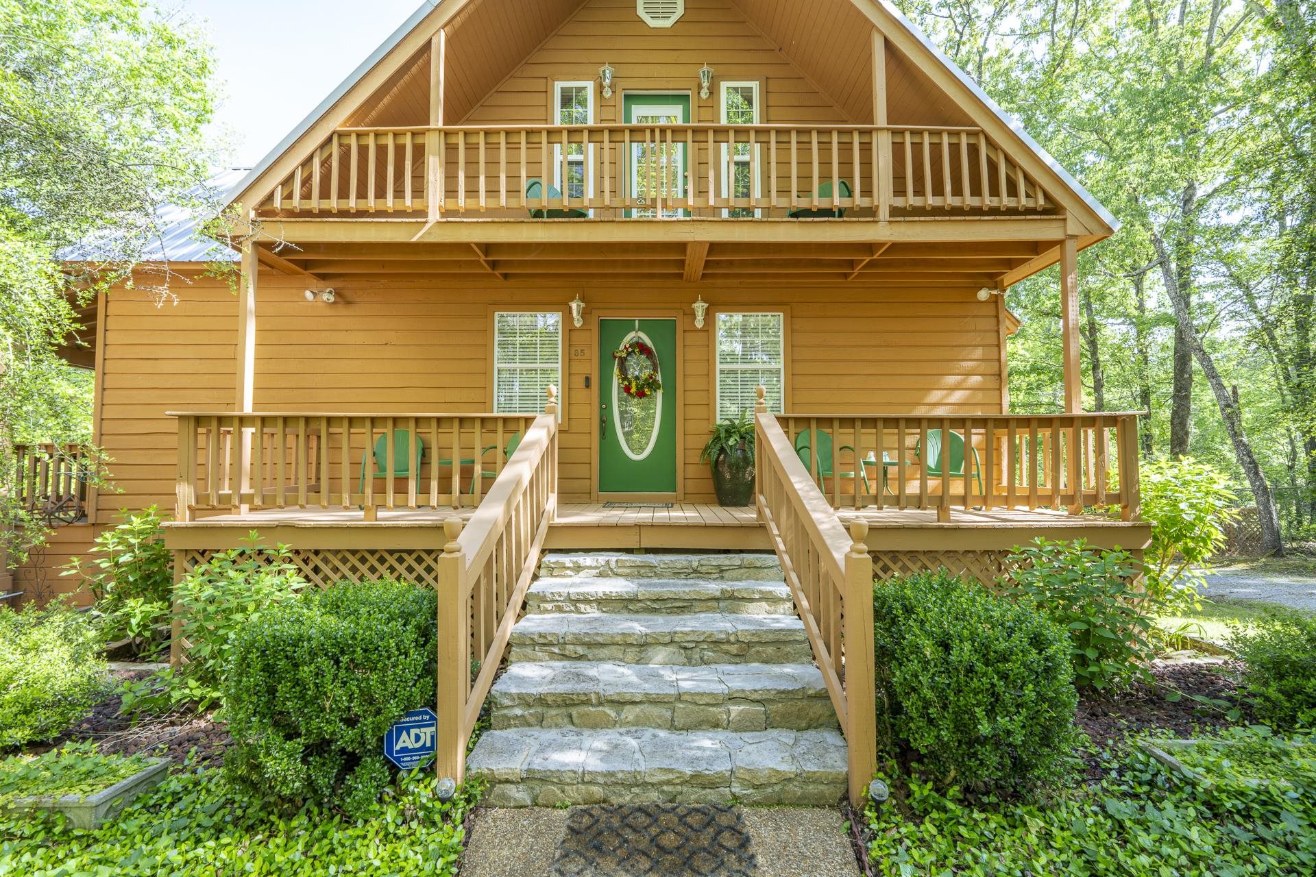 85 Cr 256 Road Iuka, MS 38852 - Photo 2 of 38 Exterior featuring wood siding, a prominent A-frame roofline, and multiple outdoor spaces