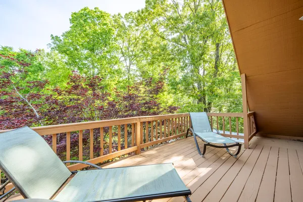 a view of a two chairs in the deck