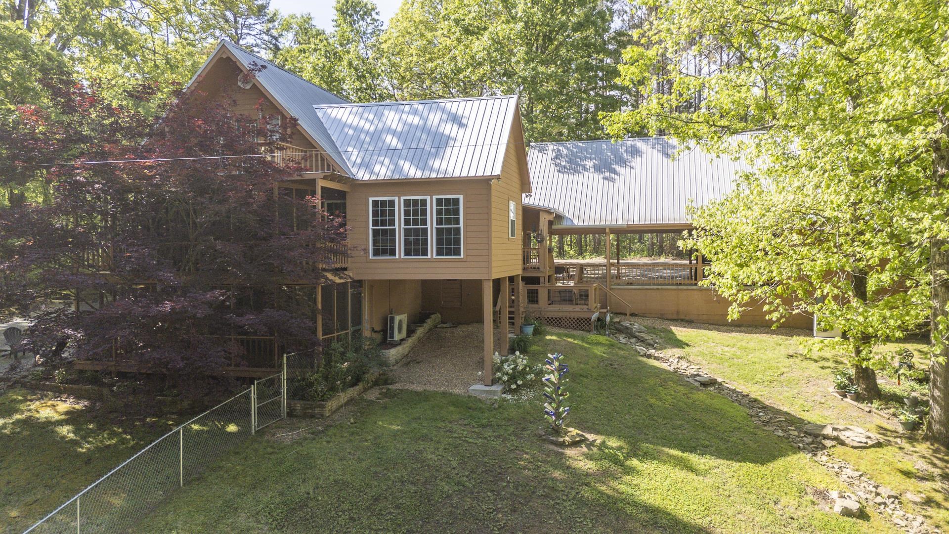 85 Cr 256 Road Iuka, MS 38852 - Photo 33 of 38 Expansive multi-level property with light brown siding and corrugated metal roofing