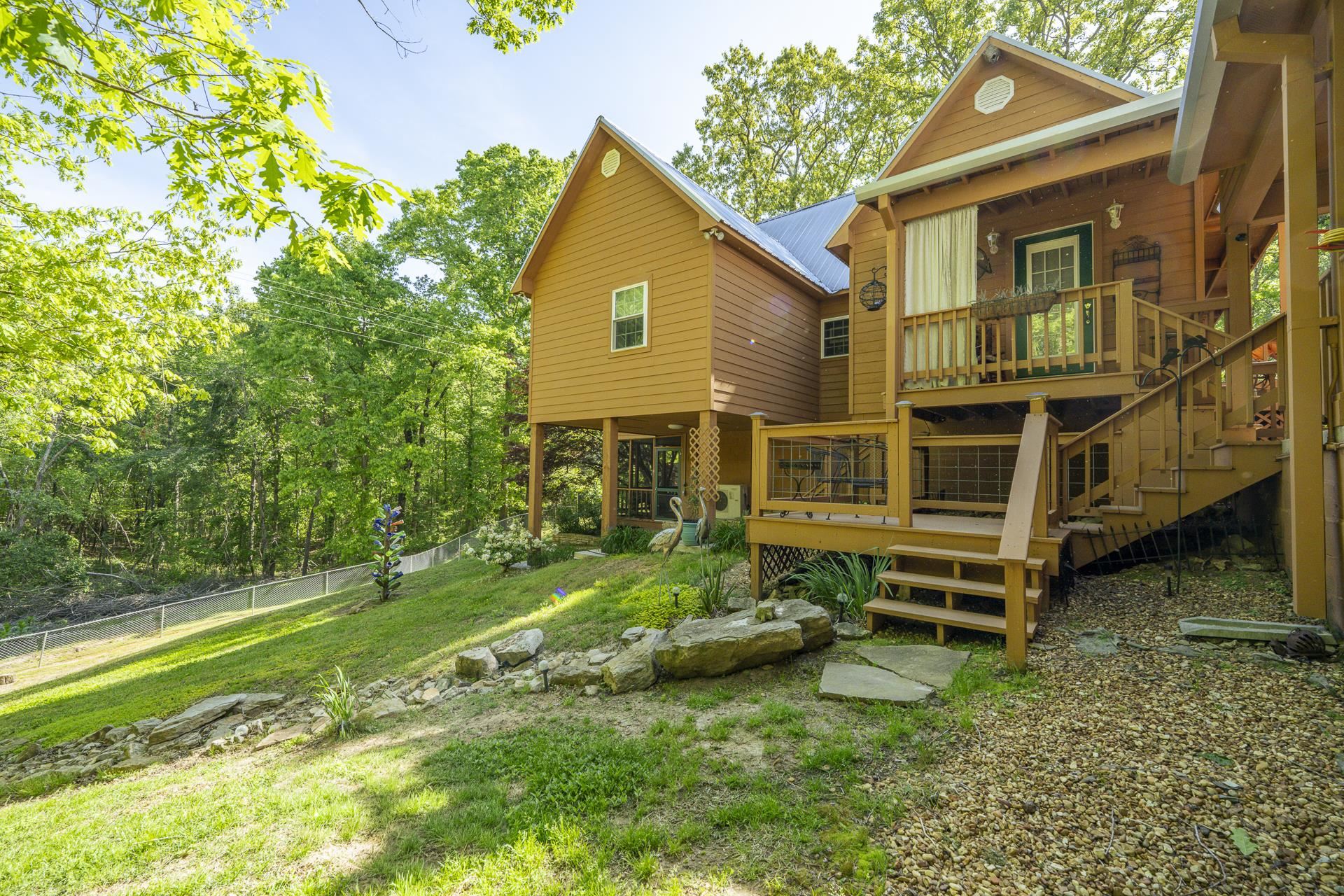 85 Cr 256 Road Iuka, MS 38852 - Photo 34 of 38 Multi-level wood deck featuring a covered porch, outdoor stairs, and gravel landscaping