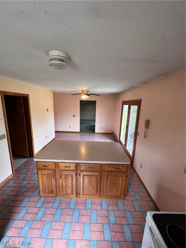 5435 Columbia Road Medina, OH 44256 - Photo 8 of 30 Kitchen featuring ceiling fan, countertops light, light tile floors, and range