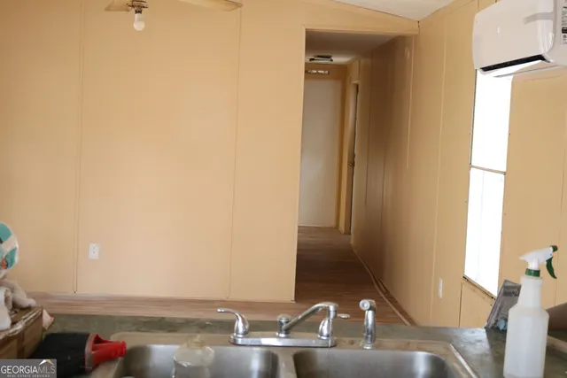 a view of a bathroom with sink and mirror