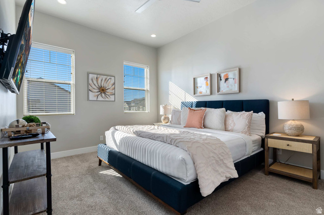 2600 Ocotillo Way, Unit 31 Santa Clara, UT 84765 - Photo 24 of 73 Carpeted bedroom featuring light gray walls, two windows with horizontal blinds, recessed lighting, and a ceiling fan