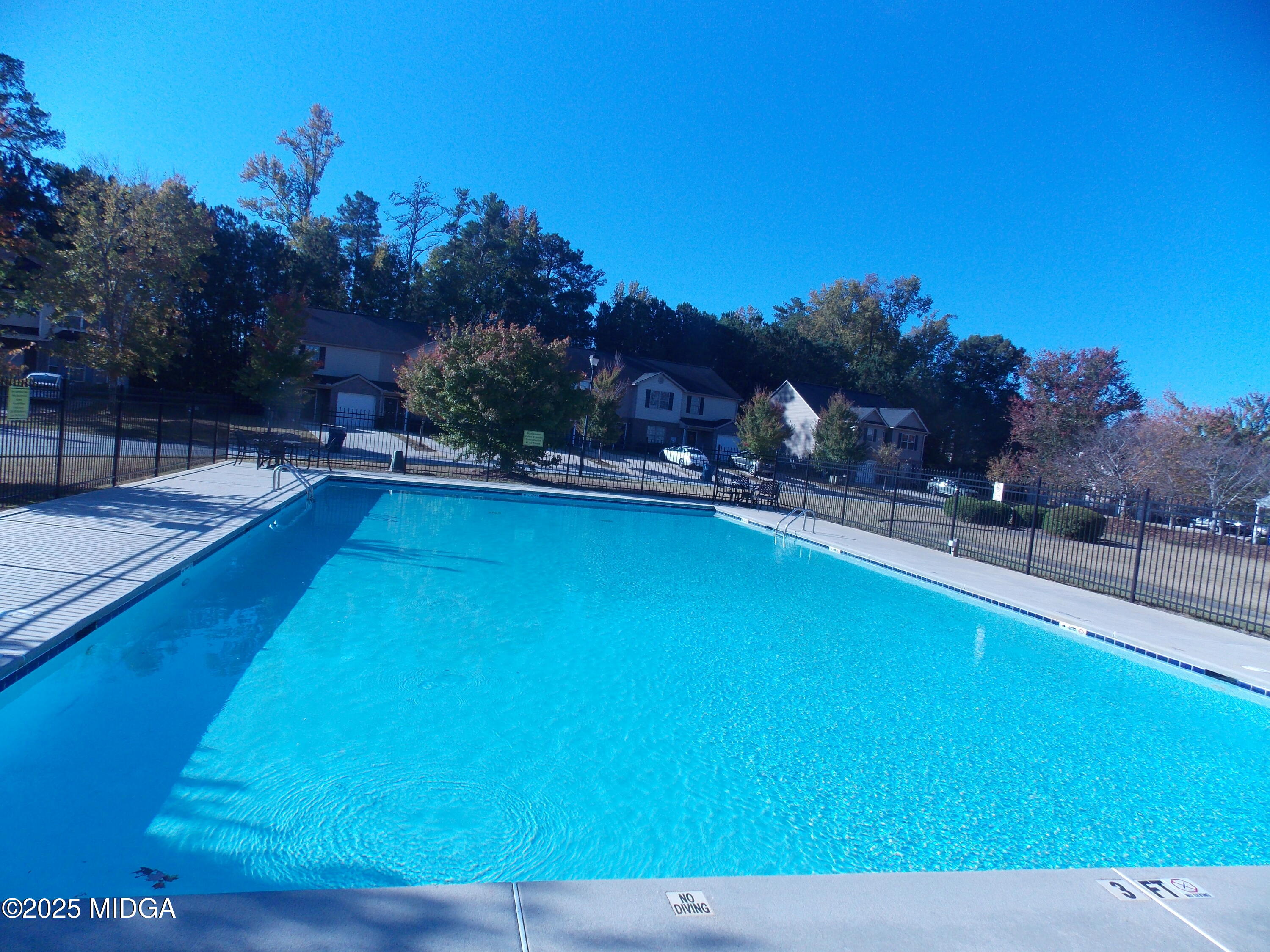 1500 Labonte Parkway McDonough, GA 30253 - Photo 15 of 15 a view of a swimming pool with an outdoor space and seating area