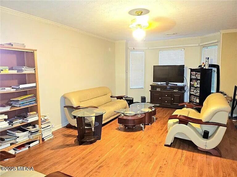 1500 Labonte Parkway McDonough, GA 30253 - Photo 2 of 15 a living room with furniture and a flat screen tv