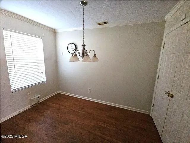 a view of room with window and hardwood floor