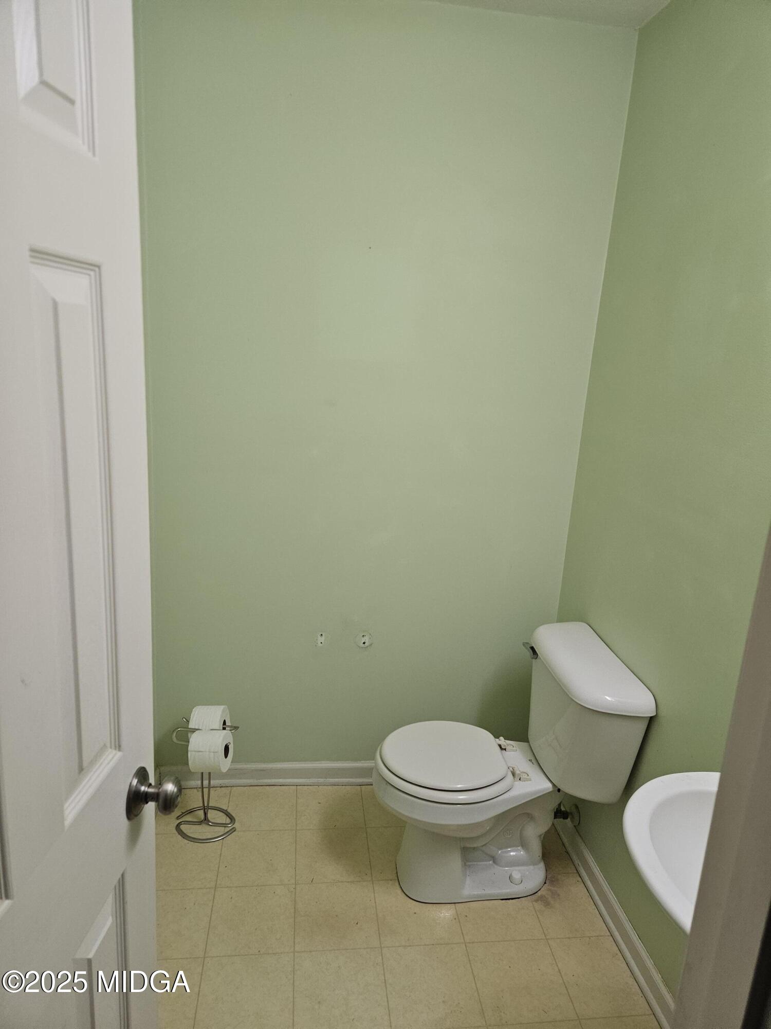 1500 Labonte Parkway McDonough, GA 30253 - Photo 5 of 15 a white toilet sitting next to a white wall
