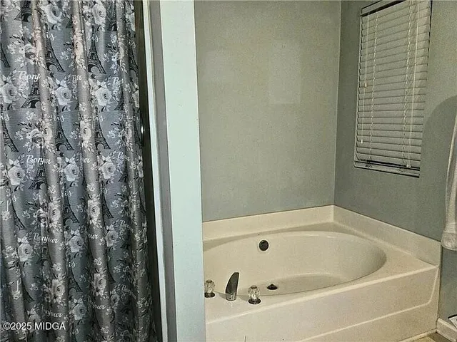 a bathroom with a bathtub