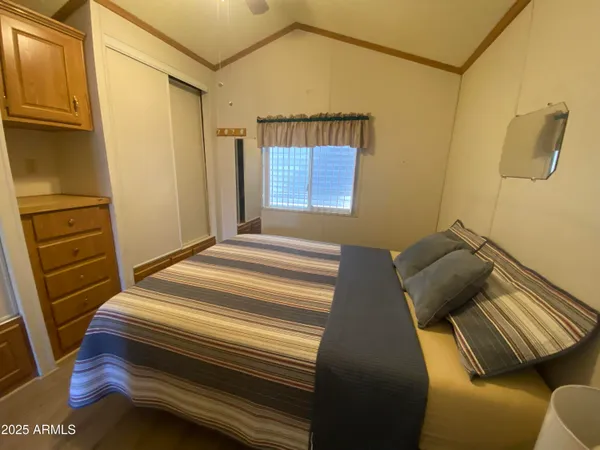 a bedroom with a bed and furniture