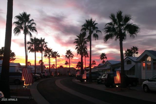 2137 West Erie Avenue, Unit 137 Apache Junction, AZ 85119 - Photo 33 of 36 an ocean view with palm trees