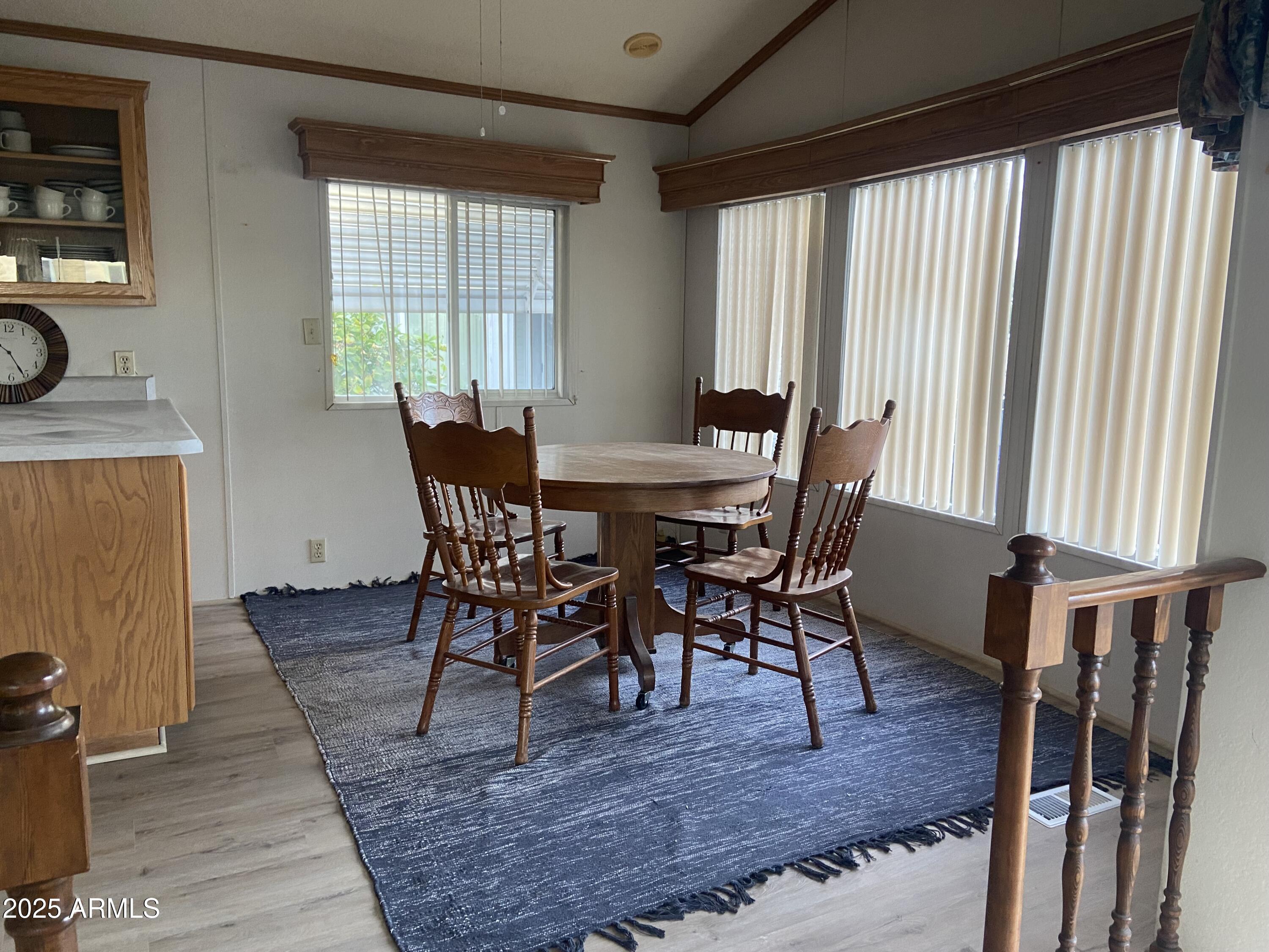 2137 West Erie Avenue, Unit 137 Apache Junction, AZ 85119 - Photo 10 of 36 a view of a dining room with furniture and window