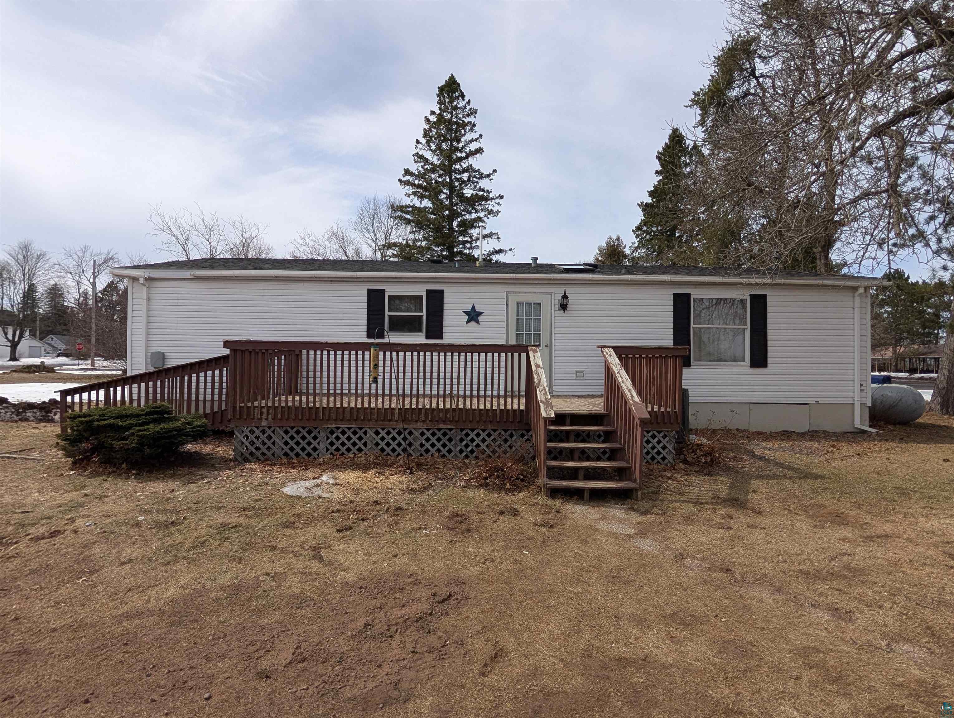 54700 Cudworth Avenue Grand View, WI 54839 - Photo 2 of 21 Back of house with a deck and heating fuel