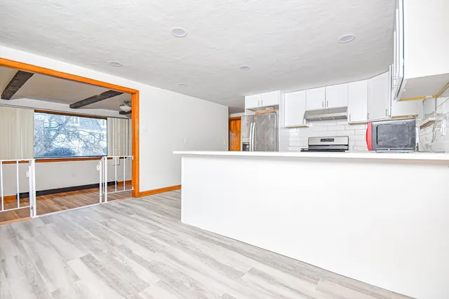 a kitchen with stainless steel appliances a refrigerator and a sink