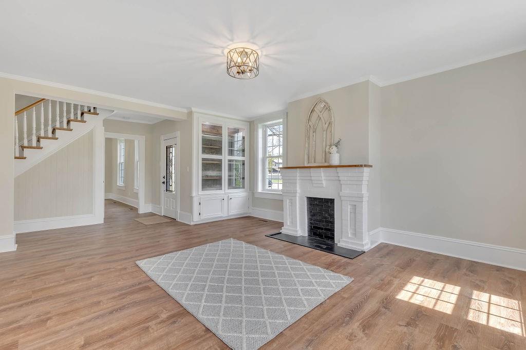800 River Road Beaver, PA 15009 - Photo 12 of 47 a view of an empty room with wooden floor fireplace and a window
