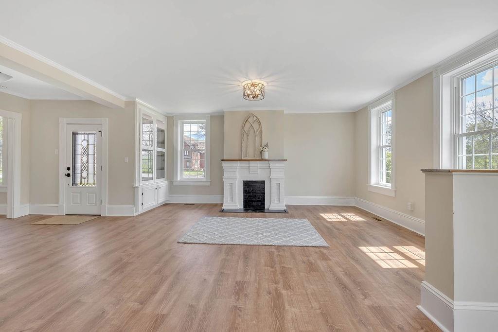 800 River Road Beaver, PA 15009 - Photo 14 of 47 an empty room with windows and fireplace