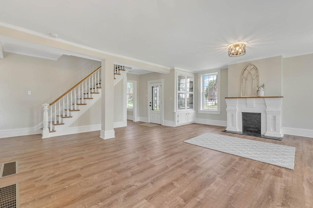 800 River Road Beaver, PA 15009 - Photo 15 of 47 a view of an empty room with wooden floor fireplace and a window