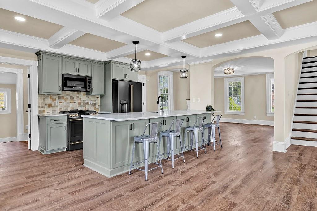 800 River Road Beaver, PA 15009 - Photo 22 of 47 a kitchen with stainless steel appliances kitchen island granite countertop a stove a sink and a refrigerator
