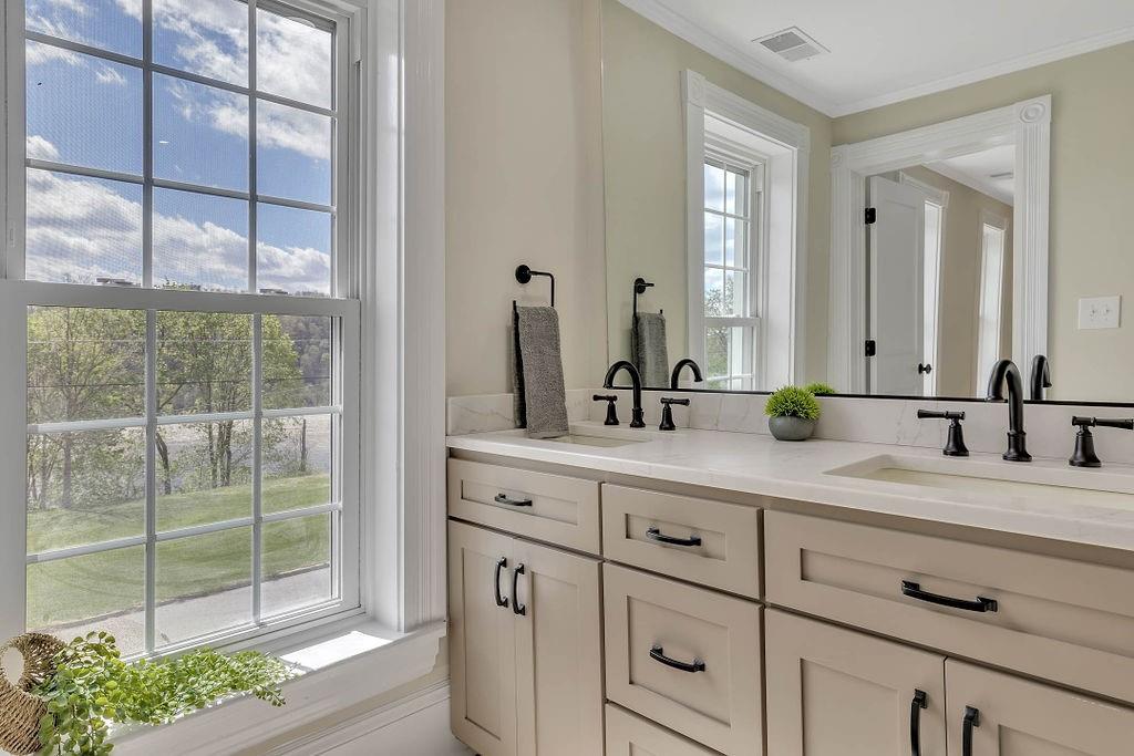 800 River Road Beaver, PA 15009 - Photo 25 of 47 a bathroom with a double vanity sink and a mirror