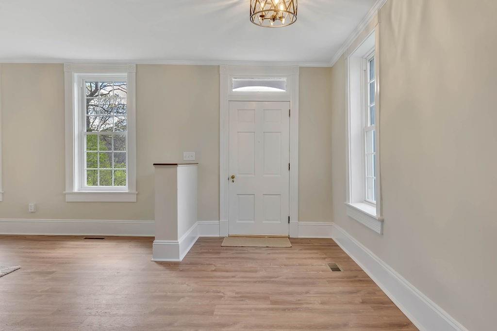 800 River Road Beaver, PA 15009 - Photo 8 of 47 an empty room with wooden floor and window
