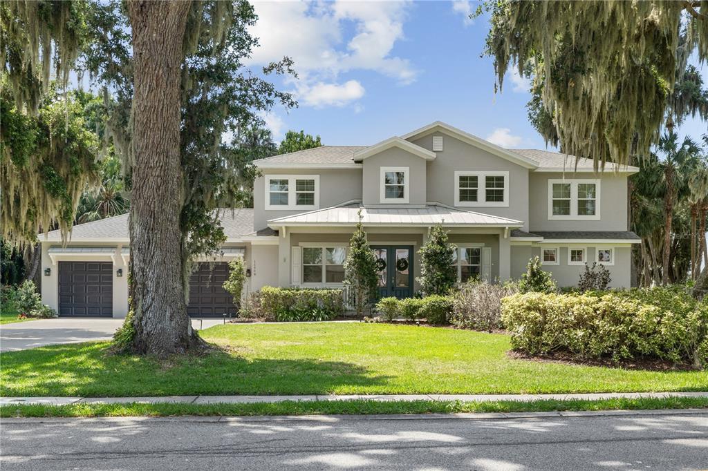 16948 Deer Island Road Tavares, FL 32778 - Photo 67 of 67 a front view of a house with garden
