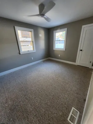 an empty room with windows