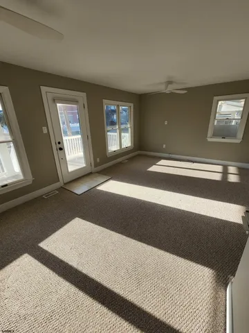 a view of an empty room and window