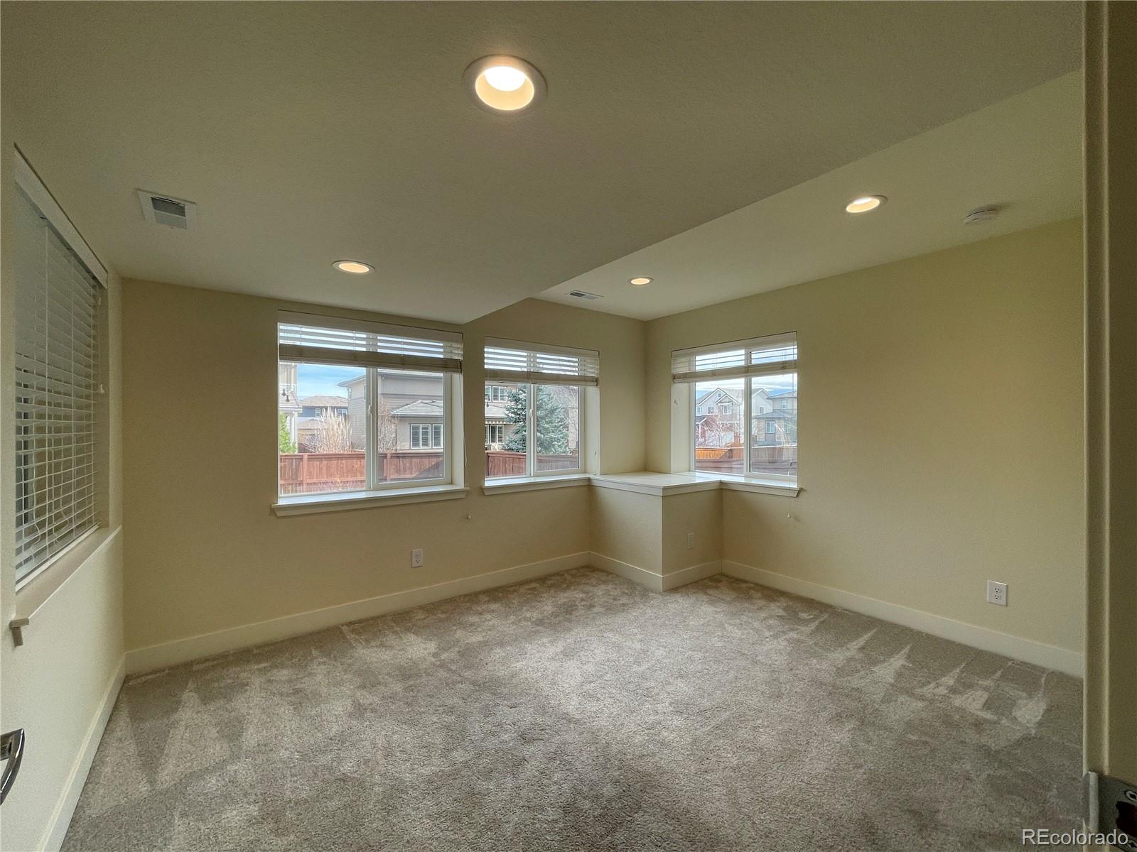 10951 Touchstone Loop Parker, CO 80134 - Photo 16 of 35 a view of an empty room with a window