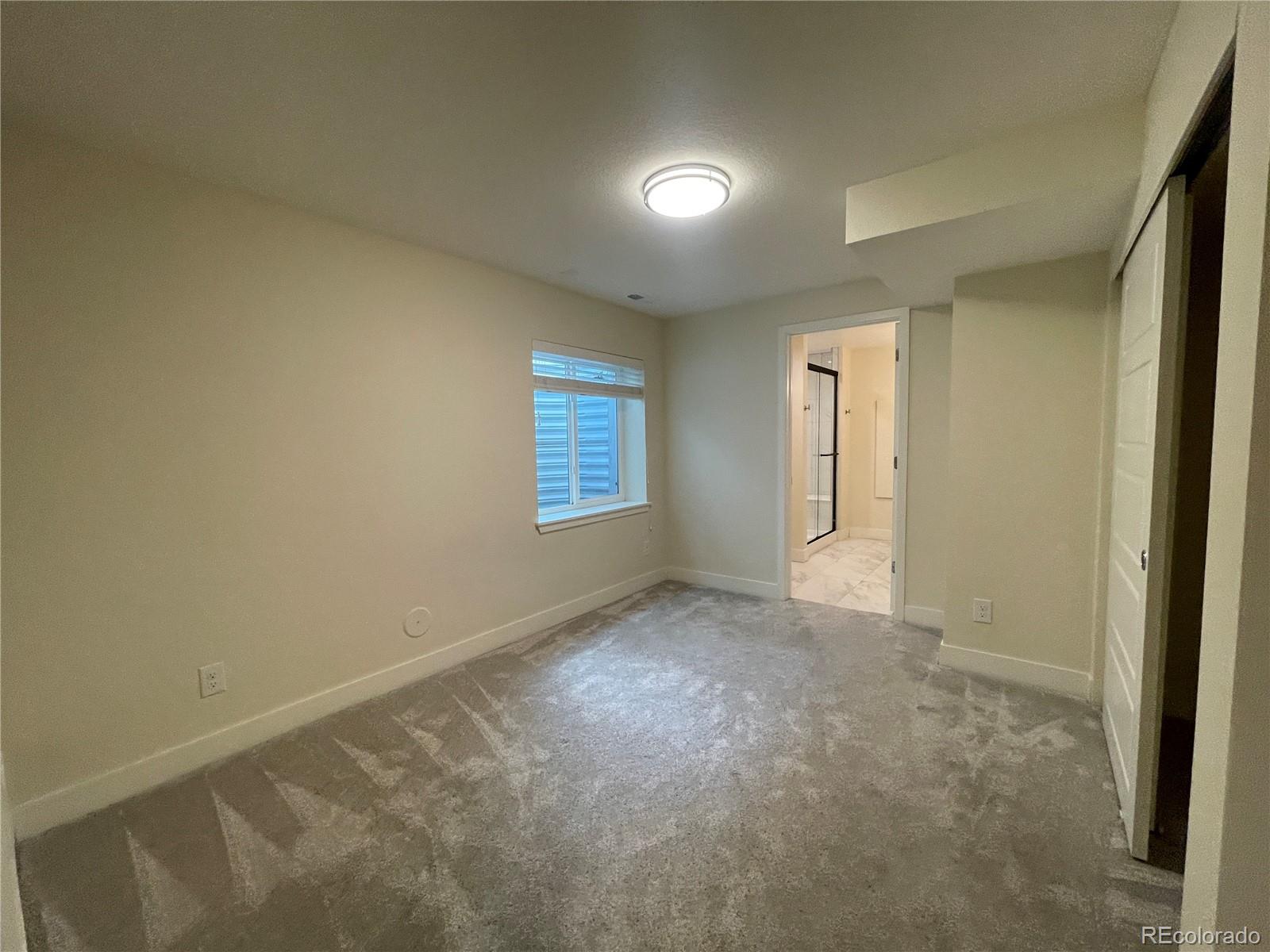 10951 Touchstone Loop Parker, CO 80134 - Photo 19 of 35 a view of an empty room with a window