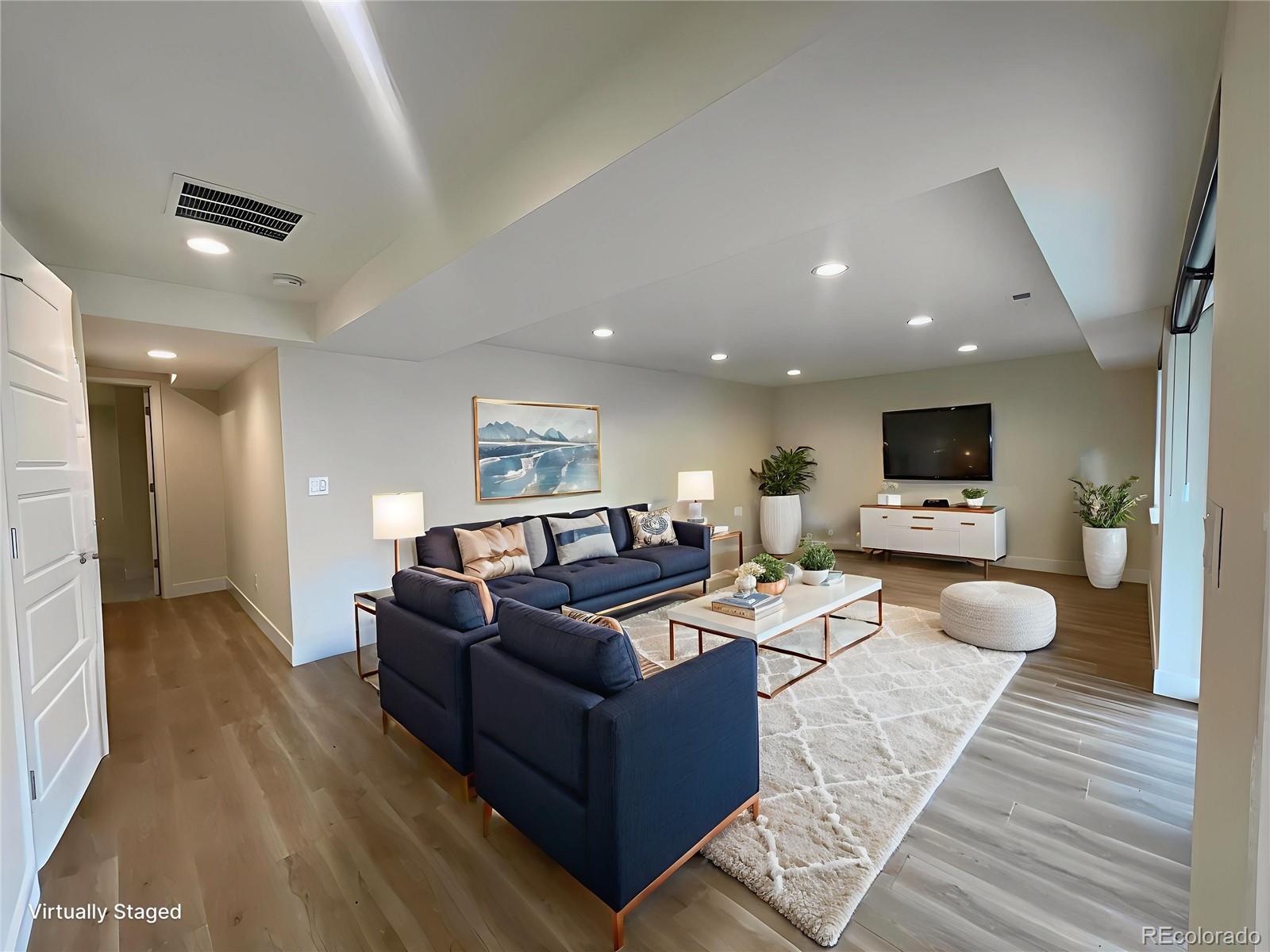 10951 Touchstone Loop Parker, CO 80134 - Photo 22 of 35 a living room with furniture and a flat screen tv