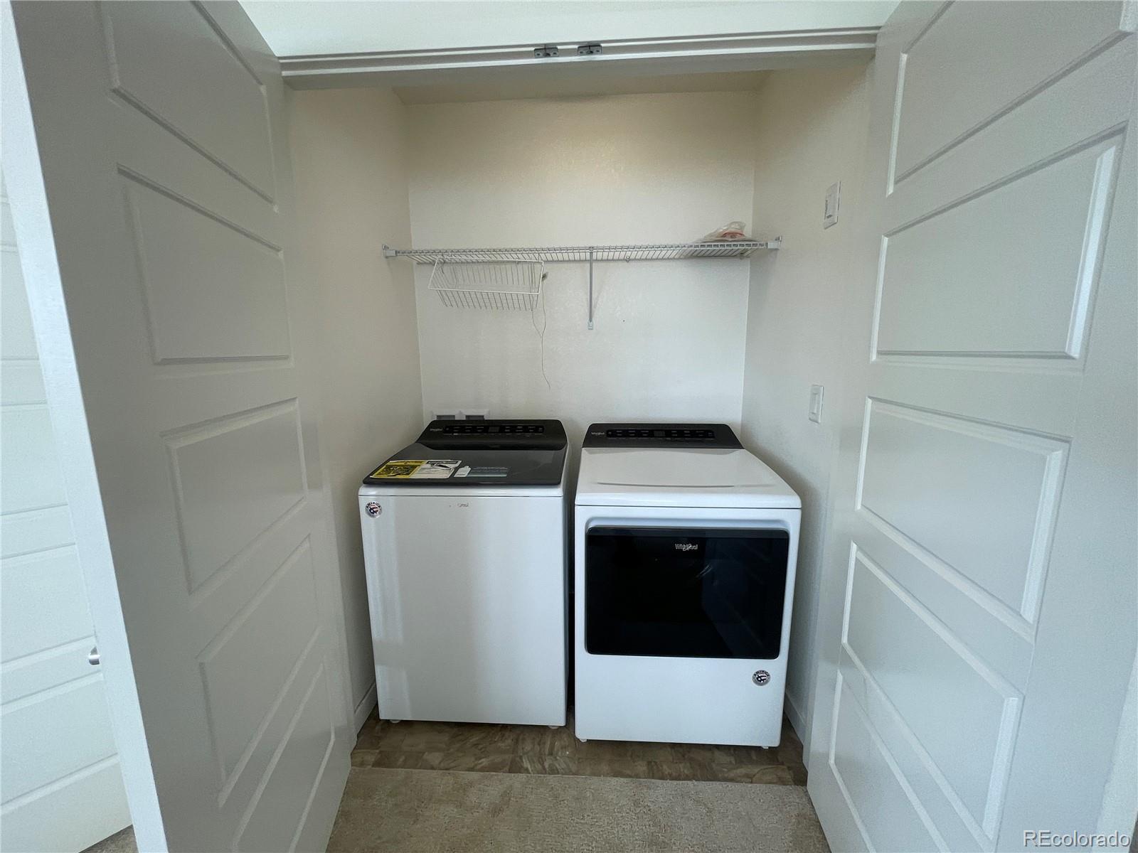 10951 Touchstone Loop Parker, CO 80134 - Photo 25 of 35 a utility room with dryer and washer