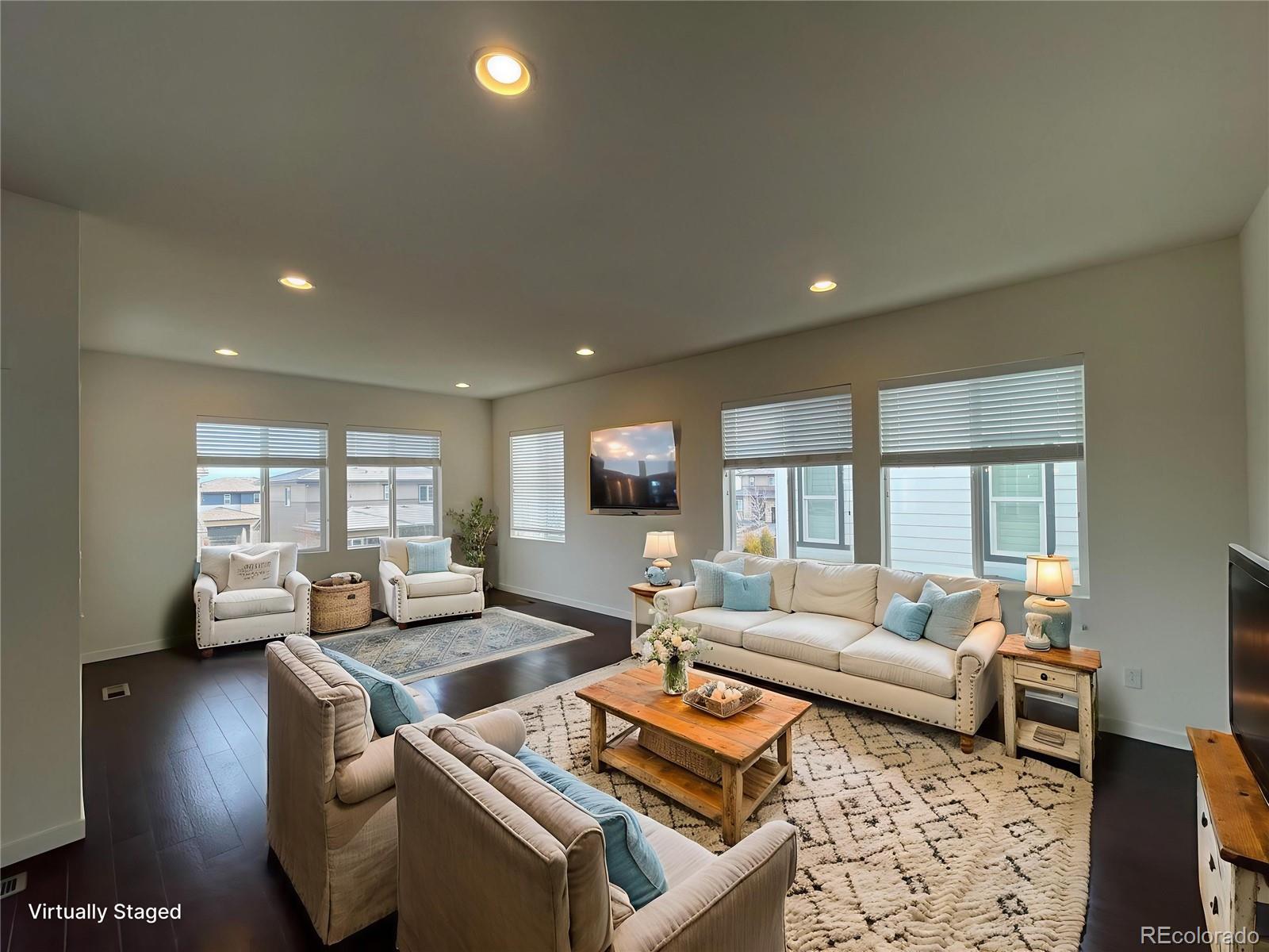 10951 Touchstone Loop Parker, CO 80134 - Photo 4 of 35 a living room with furniture and a large window