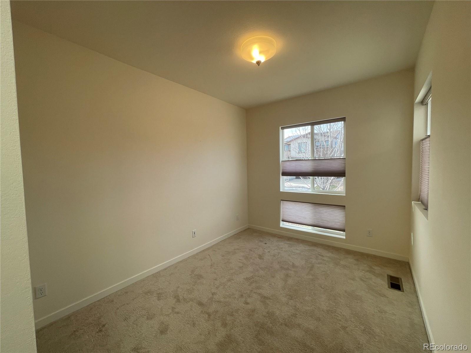 10951 Touchstone Loop Parker, CO 80134 - Photo 7 of 35 a view of an empty room and window