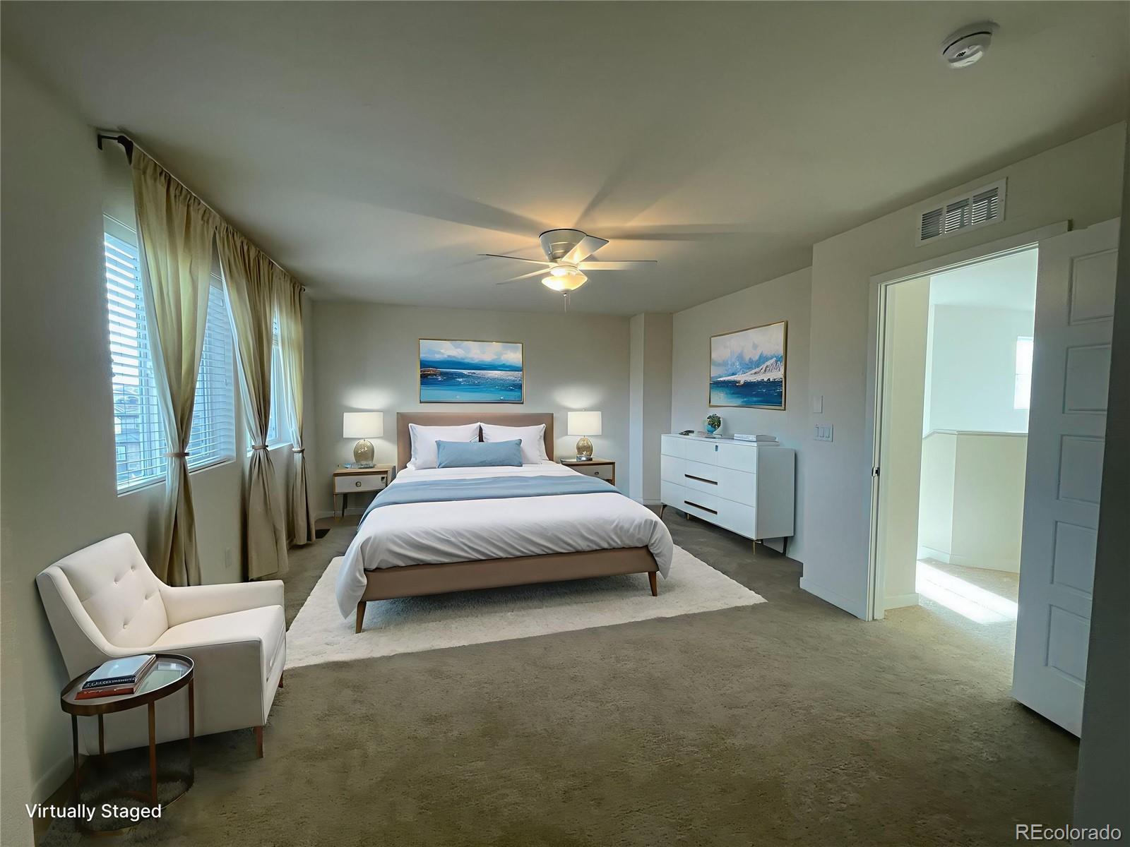 10951 Touchstone Loop Parker, CO 80134 - Photo 9 of 35 a spacious bedroom with a bed and window