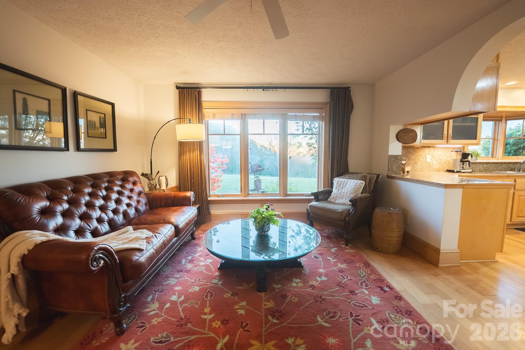 6985 Junaluska Road Boone, NC 28607 - Photo 30 of 35 a living room with furniture and a large window