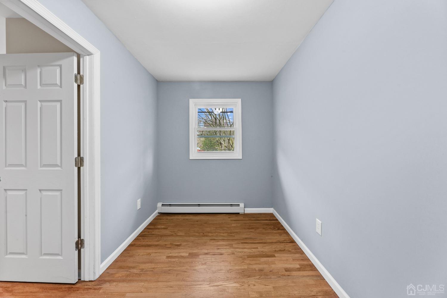 145 Texas Road Old Bridge, NJ 08857 - Photo 16 of 35 a view of room with hardwood floor and hallway
