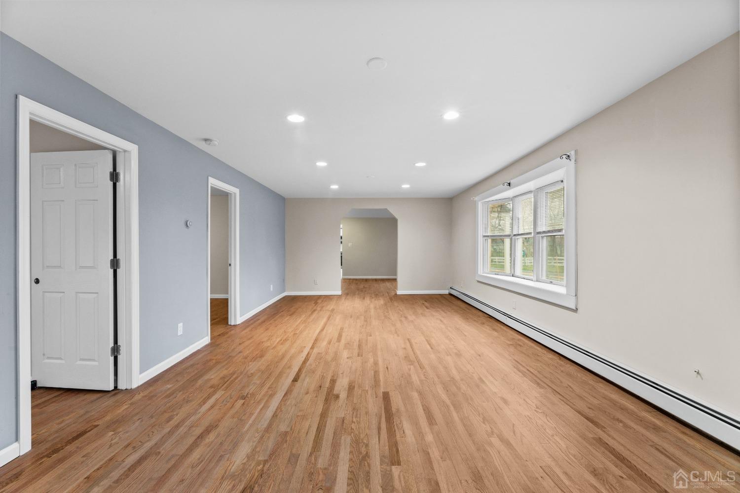 145 Texas Road Old Bridge, NJ 08857 - Photo 18 of 35 a view of an empty room with wooden floor and a window