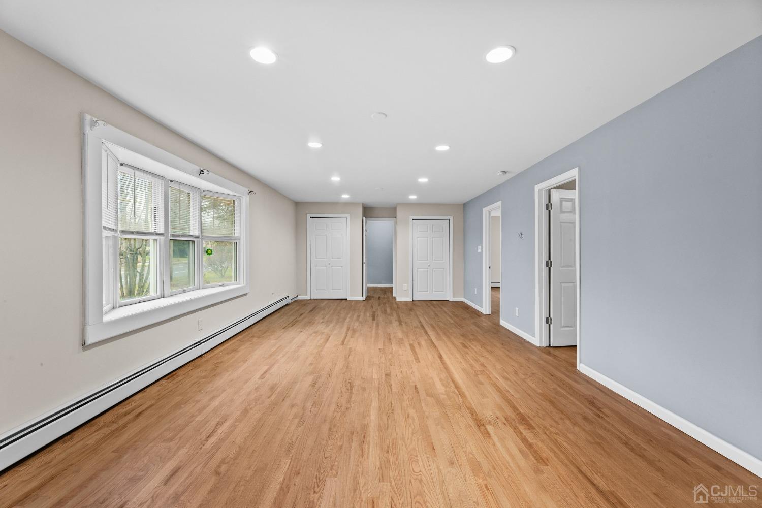 145 Texas Road Old Bridge, NJ 08857 - Photo 19 of 35 a view of empty room with wooden floor and fan